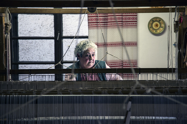 Old woman working at a loom. Photo by silas8six.